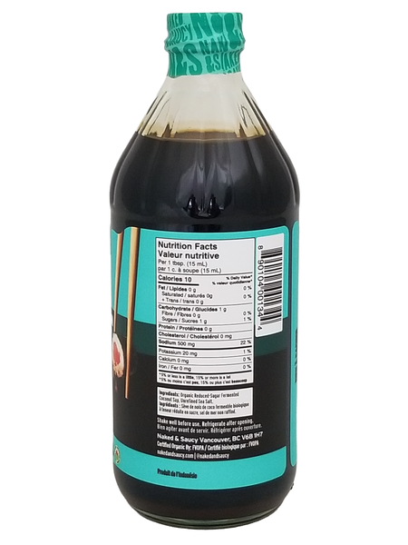 Bottle of Naked & Saucy Soy Sauce Substitute, 473ml/16.6 fl oz with a label showing nutritional information on a white background