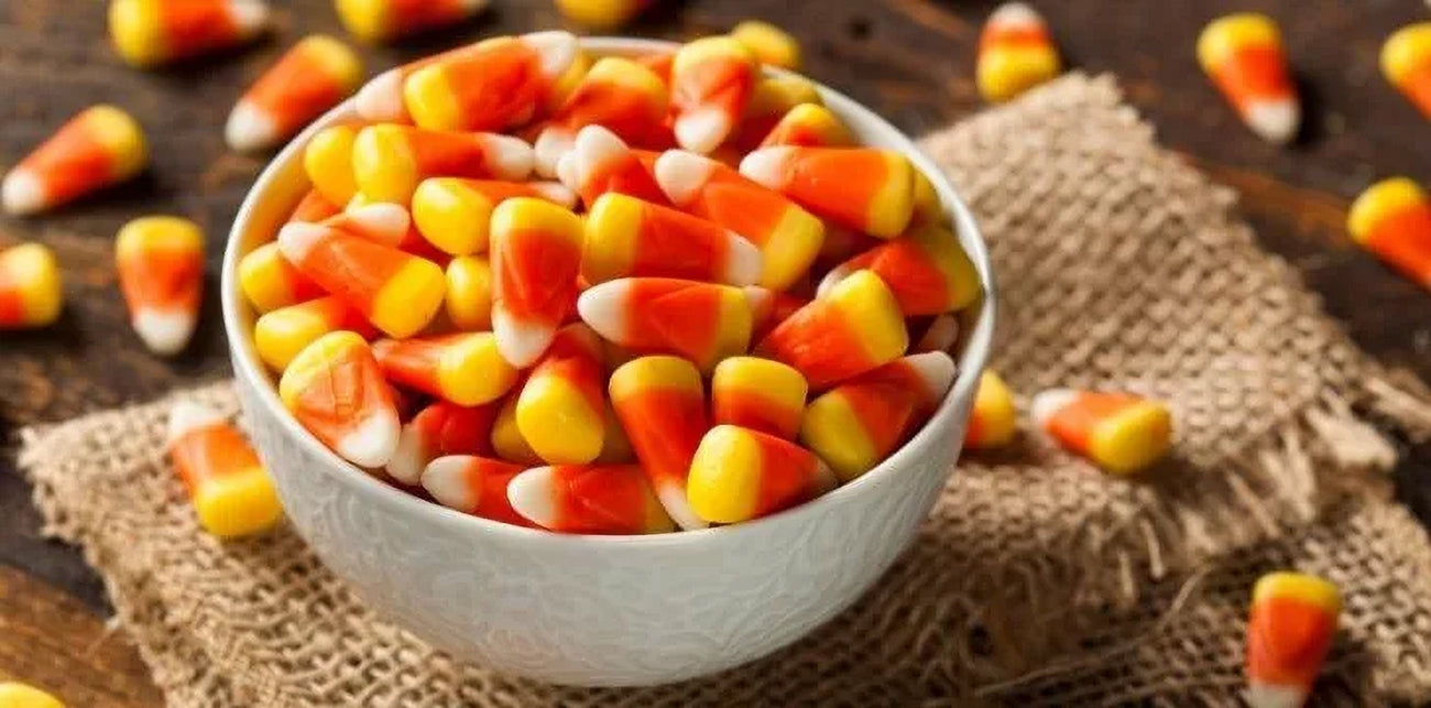 Nature's Bounty Candy Corn in a bowl on a wooden surface