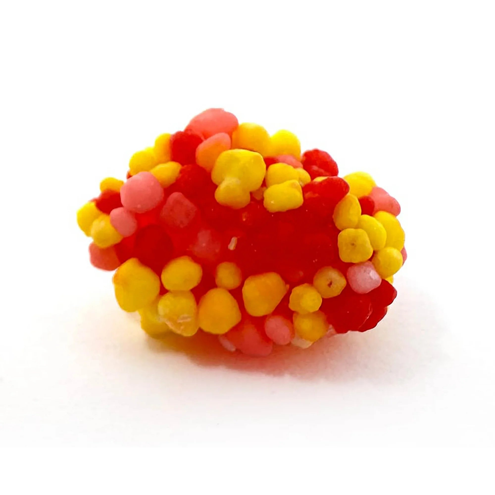 Close-up of a single Nerds Gummy Cluster showing crunchy Nerds candy coating over a soft chewy gummy center