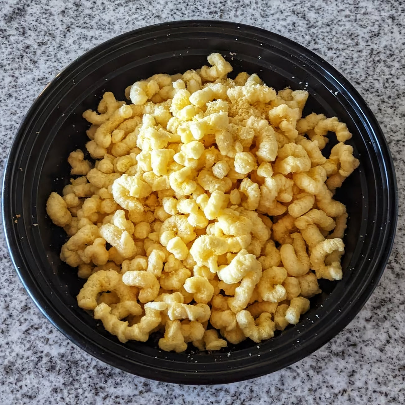 Old Dutch Popcorn Twists, convenient snack size, 20g, twists in a bowl.