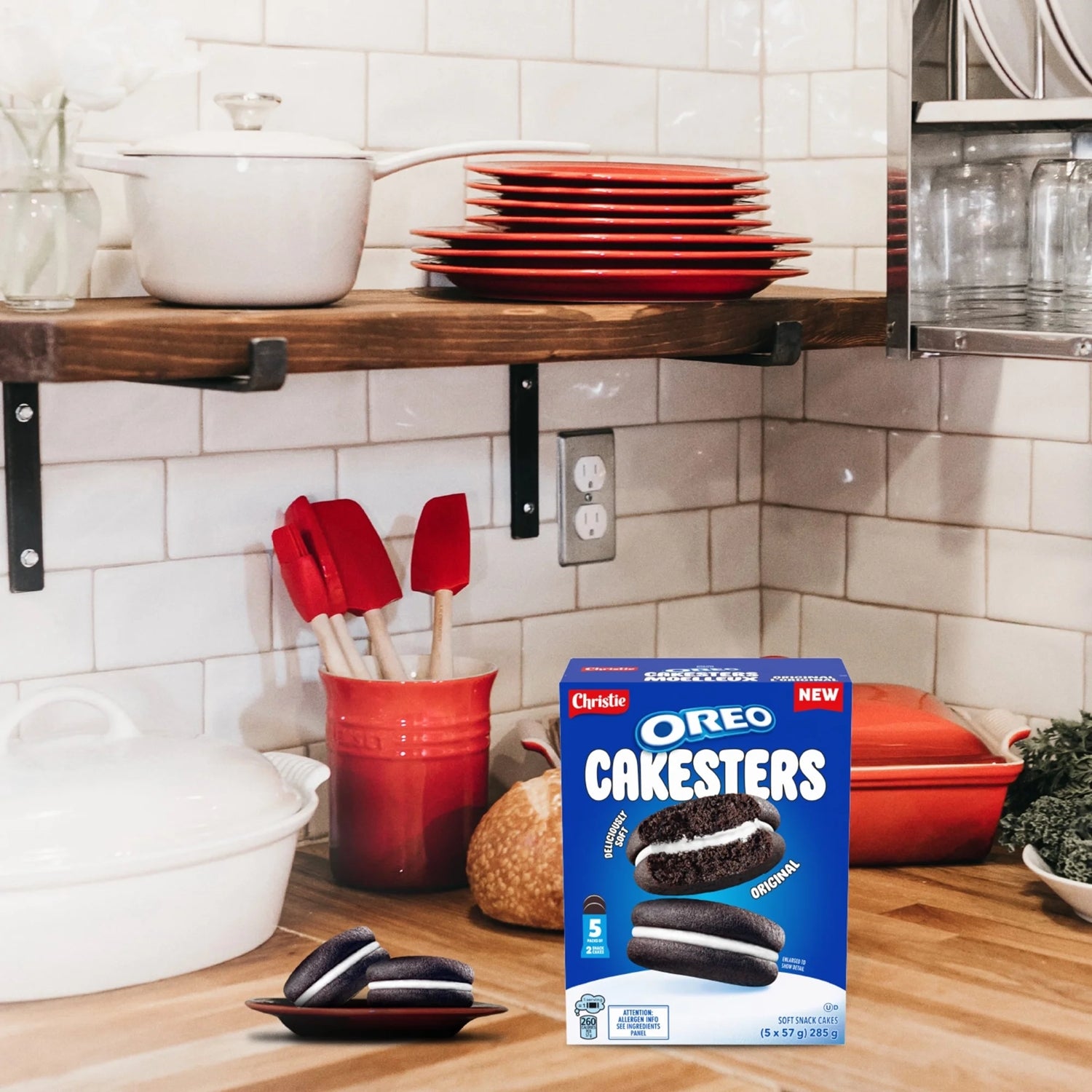 Box of Oreo Cakesters on a kitchen counter with baking tools and ingredients.