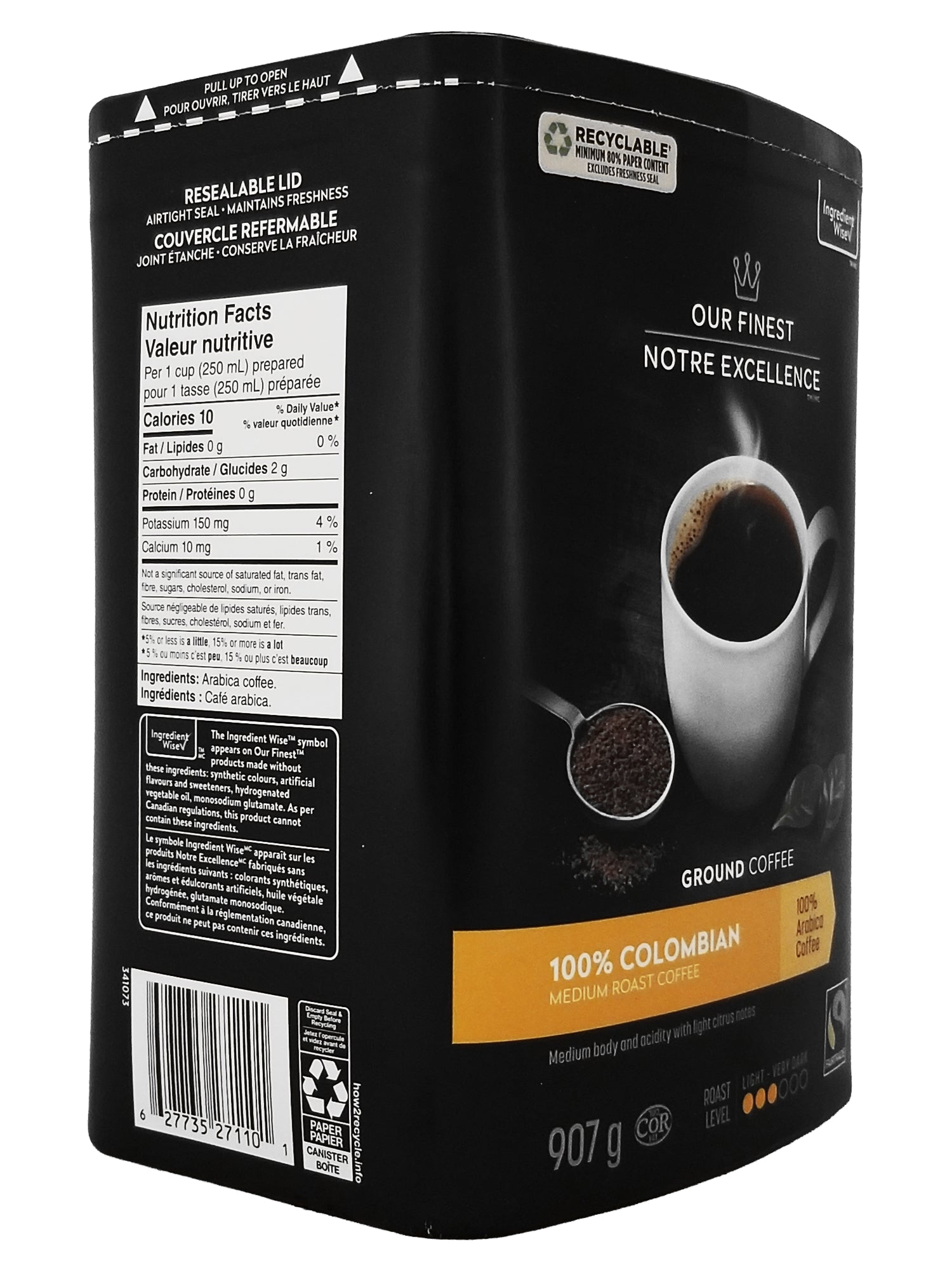 Angle of a Our Finest 100% Colombian Medium Roast Ground Coffee - 907g packaging with a cup of coffee and coffee grounds on a white background