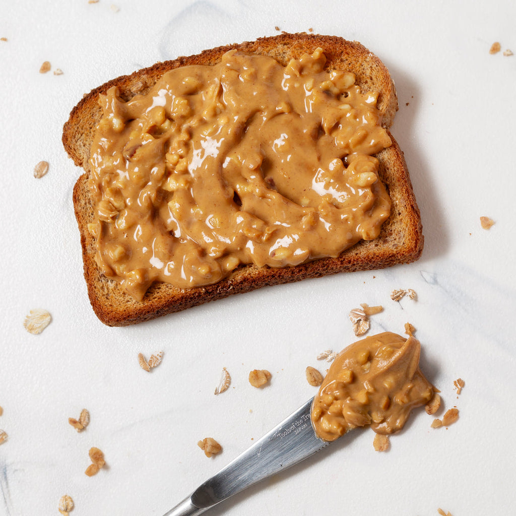 Adams 100% Natural Crunchy Peanut Butter on toast