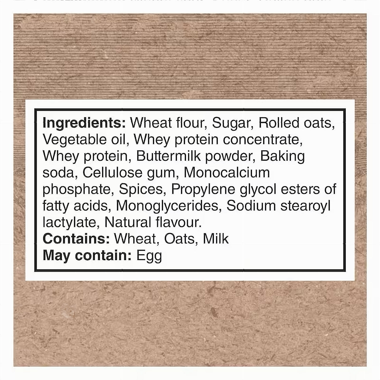 Ingredients label for Quaker PROTEIN Muffin Mix Oatmeal, 750g package on a brown background