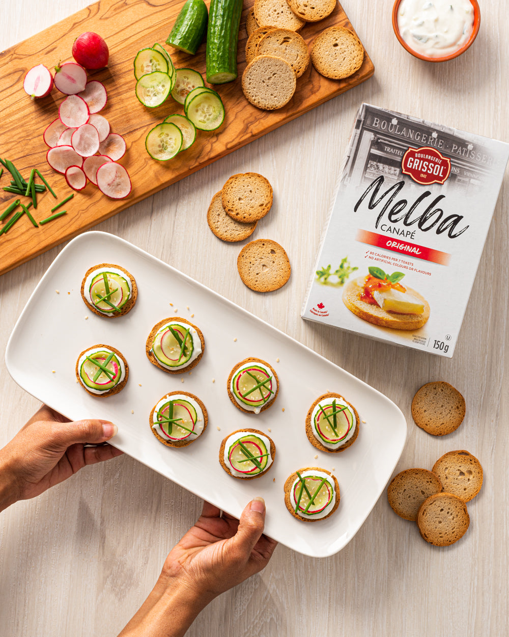 Boulangerie Grissol Melba Canape, Original, 150g, prepared canape slices snacks on a plater.