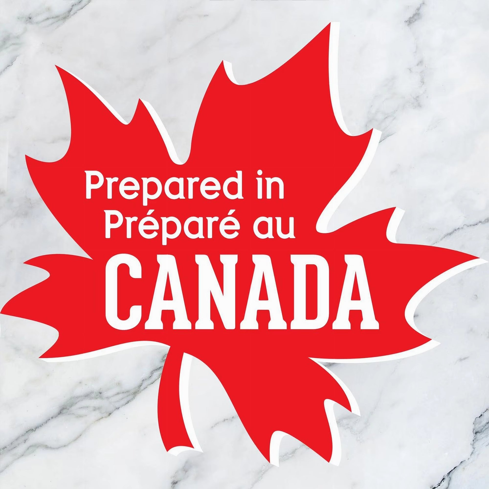 Red maple leaf with 'Prepared in Canada' text on a marble background
