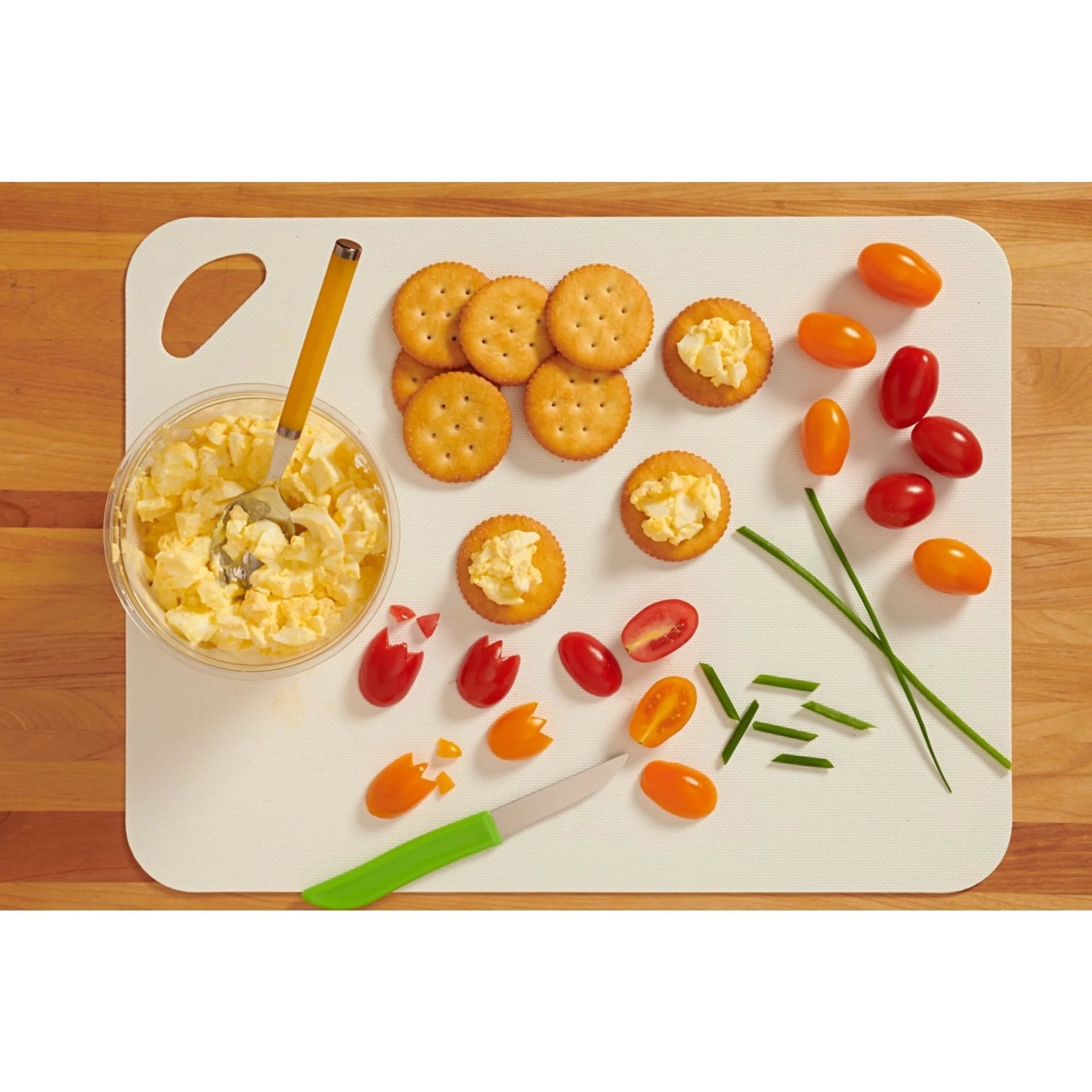 Tray with Ritz Bacon Dippers Crackers and vegetables on a wooden surface