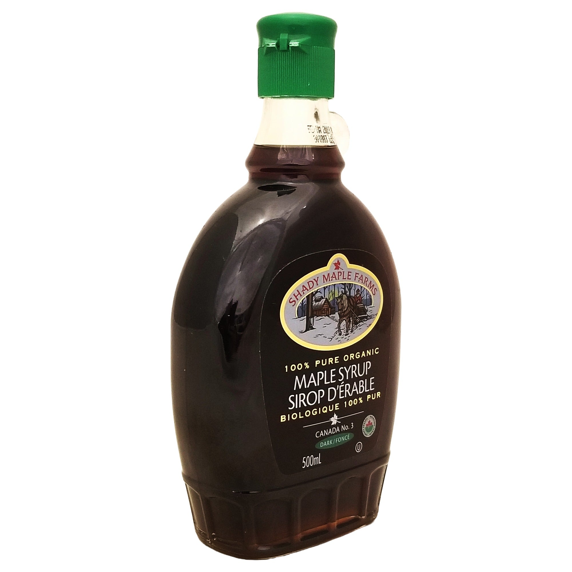 Angled Shady Maple Farms organic dark maple syrup 500 mL bottle showing the front label and broad glass side.