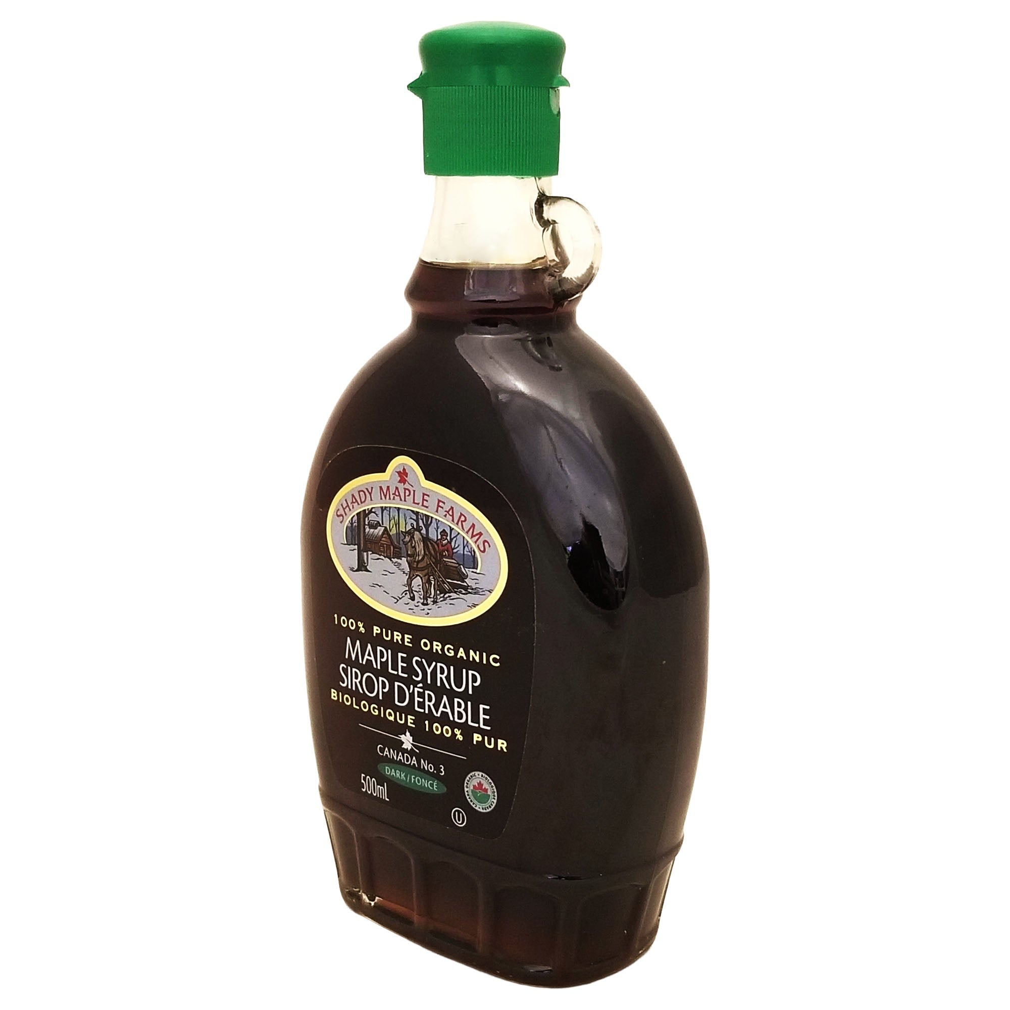 Shady Maple Farms organic dark maple syrup 500 mL bottle viewed from the opposite angle, showing the glass handle and green cap.