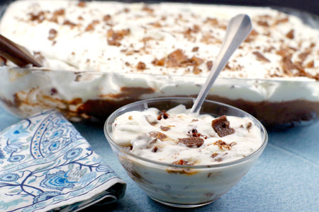 Harlan's Crushed Skor Stir-In, 2.26kg/79.7 lbs., Box, desert topped with crushed skor bits.