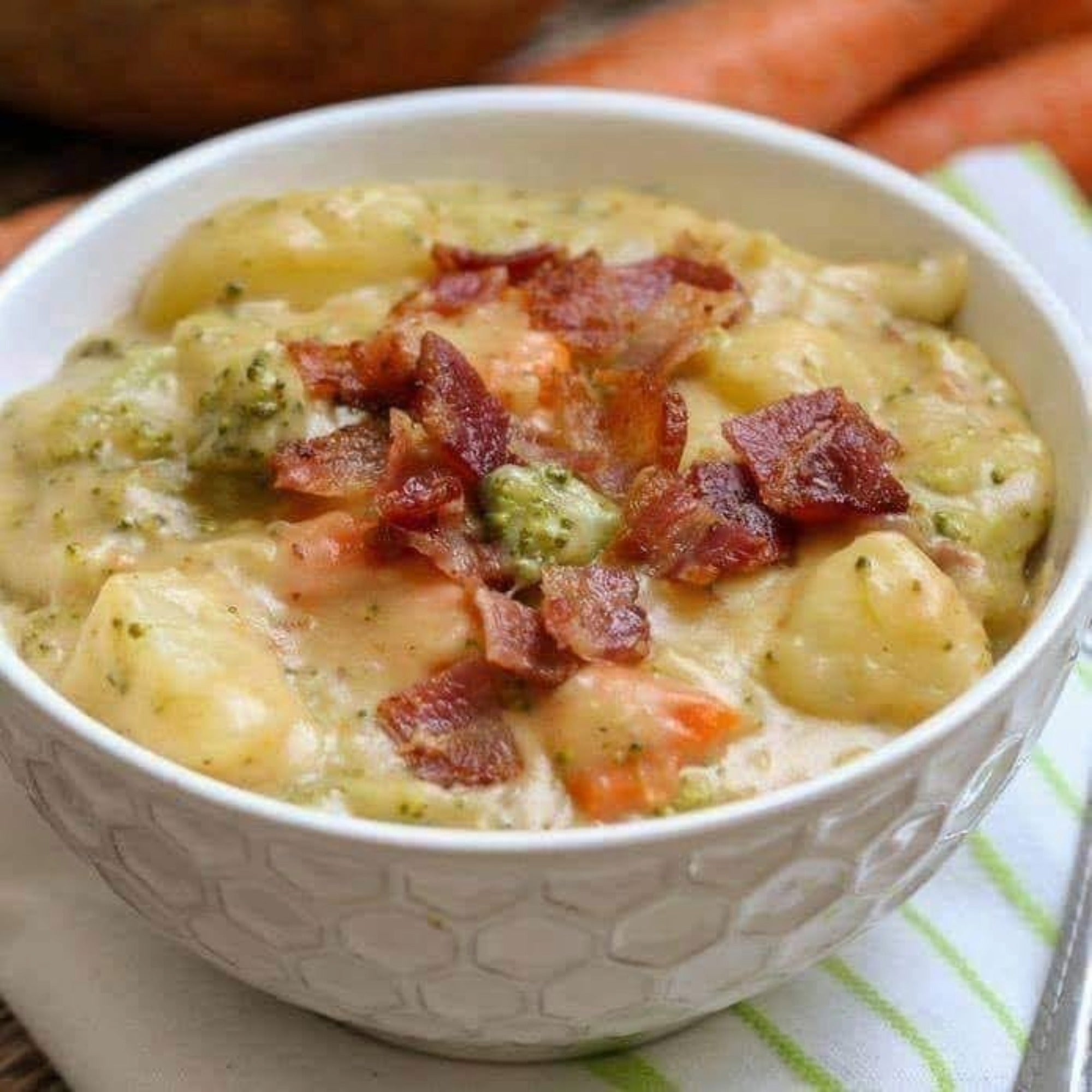 Tim Hortons Loaded broccoli, potato and bacon soup served in a white bowl with bacon pieces on top.