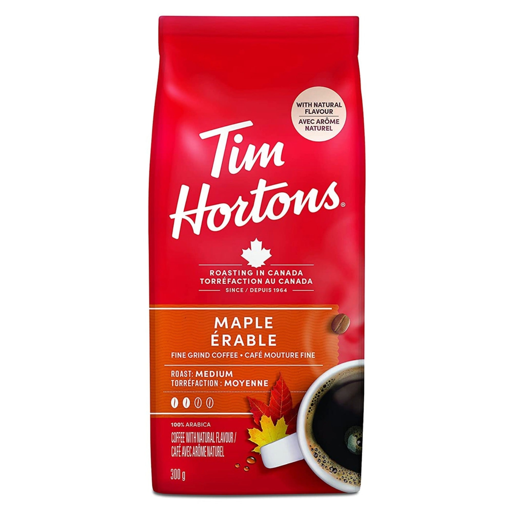 Front of a red Tim Hortons package maple flavor, with a cup of coffee and oat leaves.