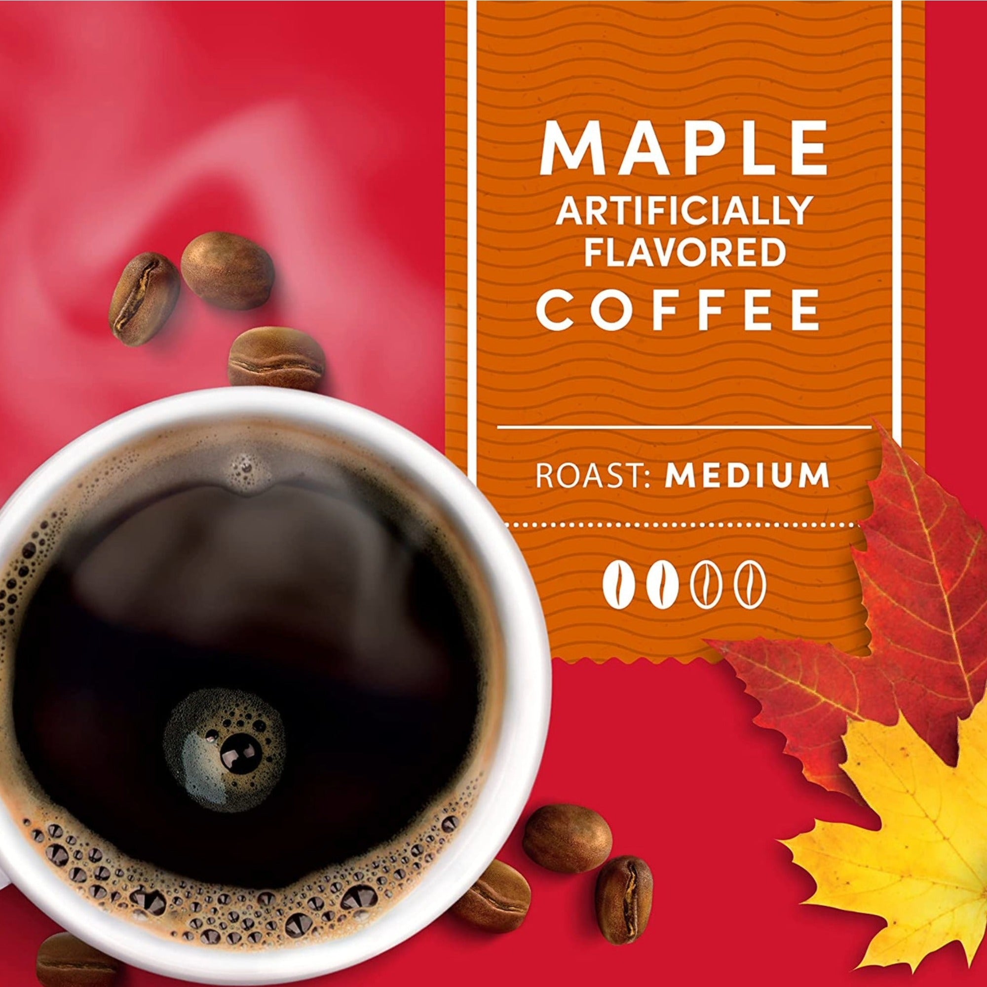 An orange label that says: Maple artificially flavored coffee, with a red background, two oak leaves, some whole coffee beans scattered around a prepared cup of coffee.