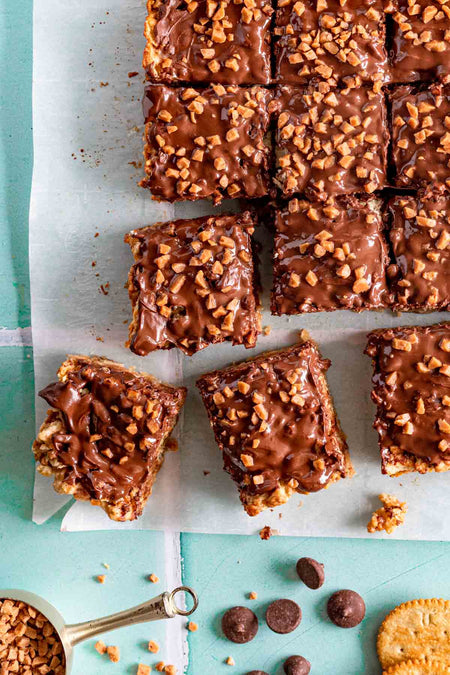 Harlan's Crushed Skor Stir-In, 2.26kg/79.7 lbs., Box, cookie bars topped with crushed skor bits.