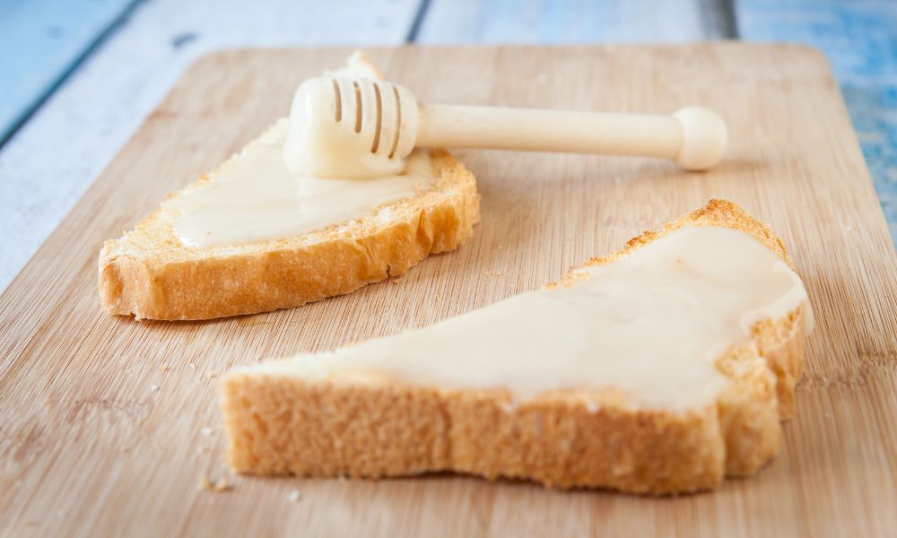 Great Value Pure Creamed Honey, 1kg/35.3 oz., Tub, honey on toast.