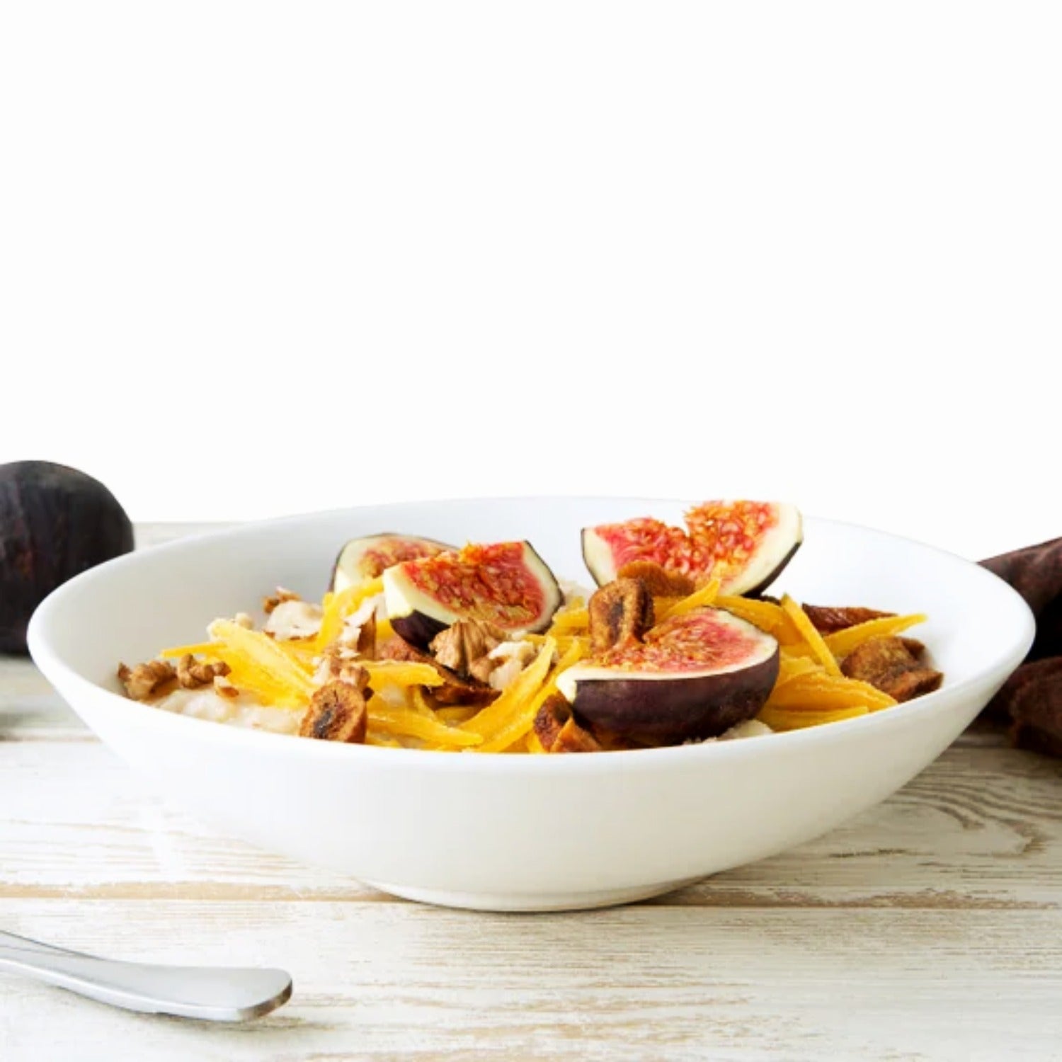 Yupik dried mango slices on oatmeal — bulk fruit snack serving suggestion