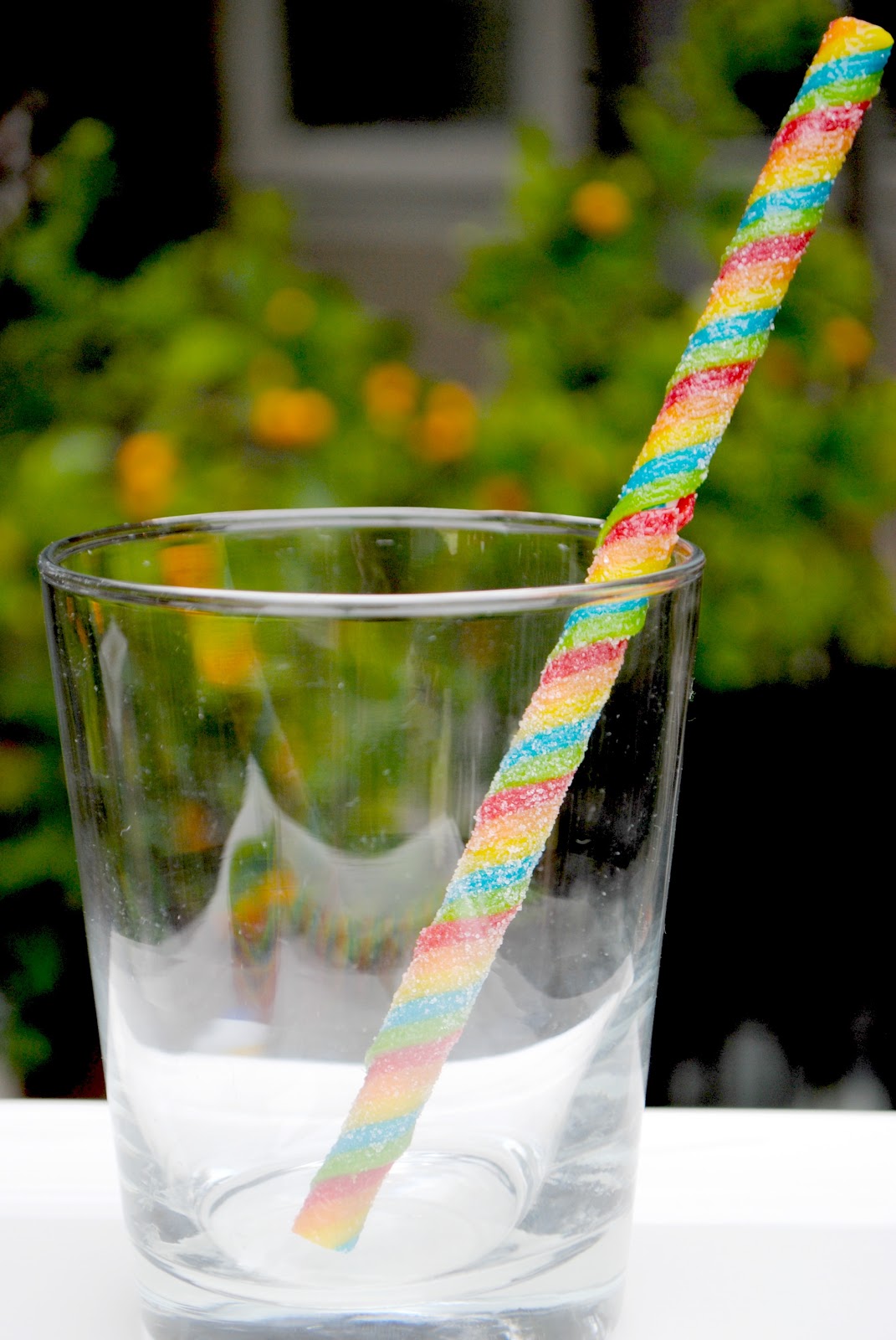 Huer Sour Rainbow Creme Whips Gummy Candy, 70g/2.5 oz., one sour cream whip in a glass.