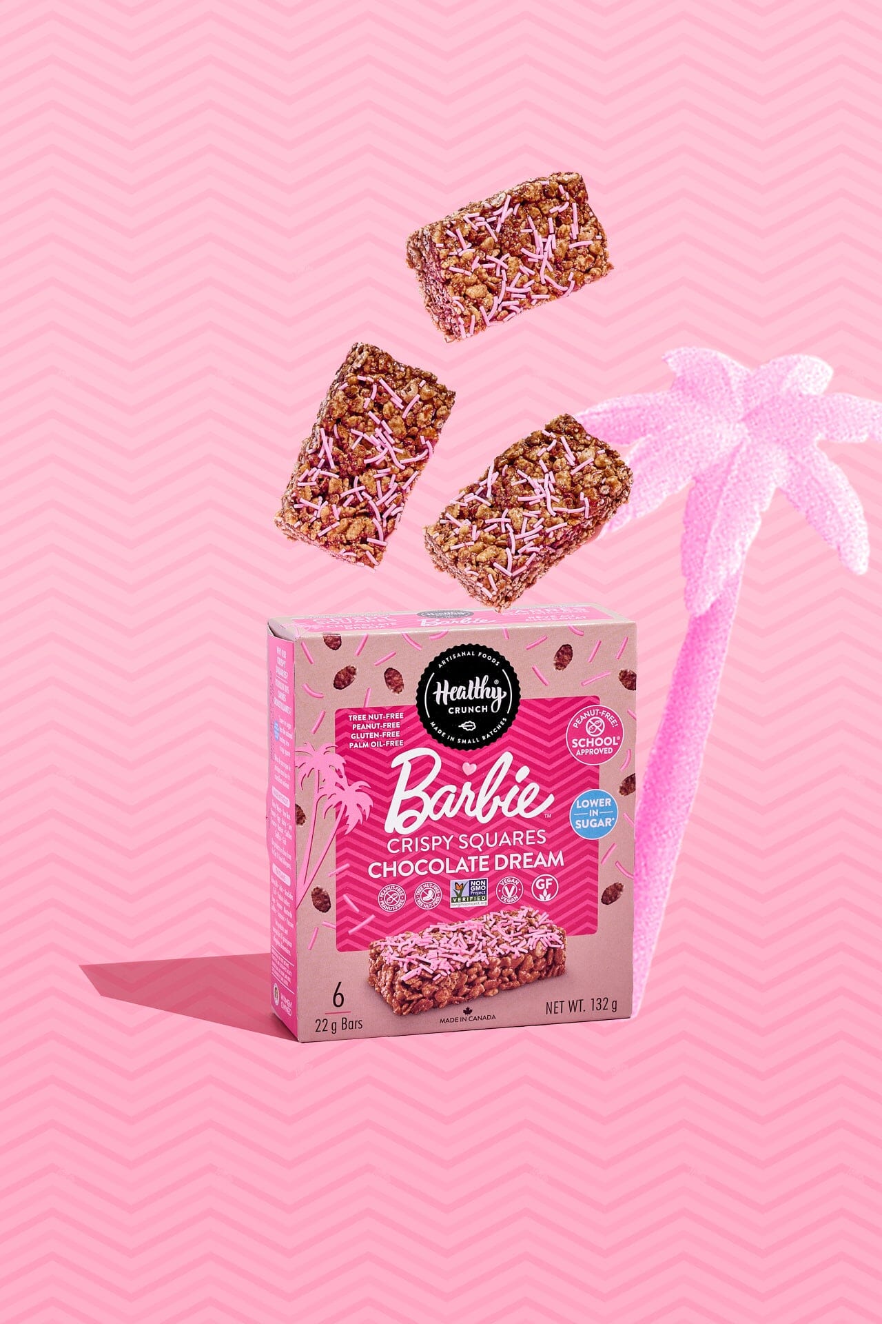 Box of Barbie chocolate dream crispy squares with three bars on a pink background