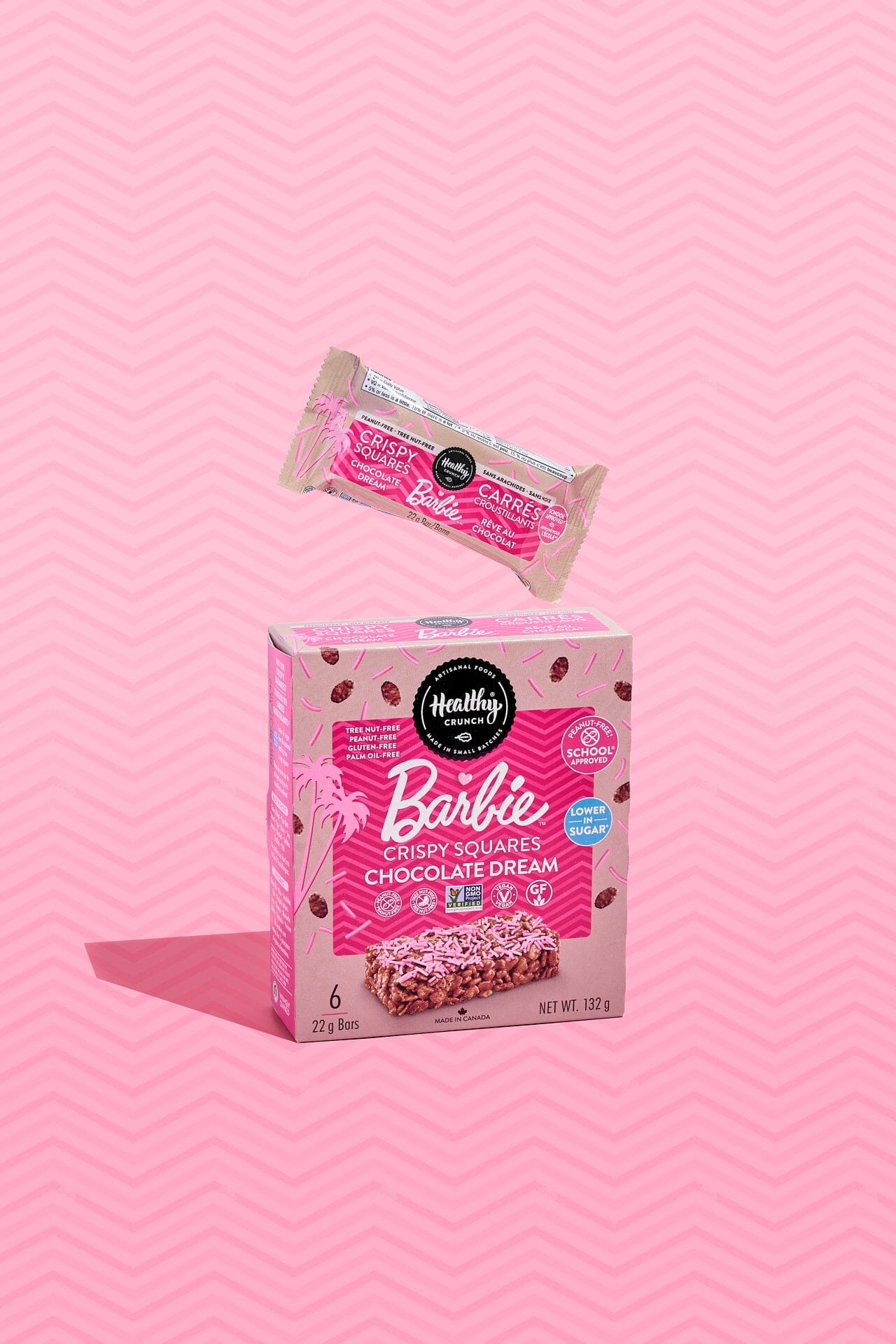 Box and single bar of Nestlé Barbie Crispy Squares on a pink background