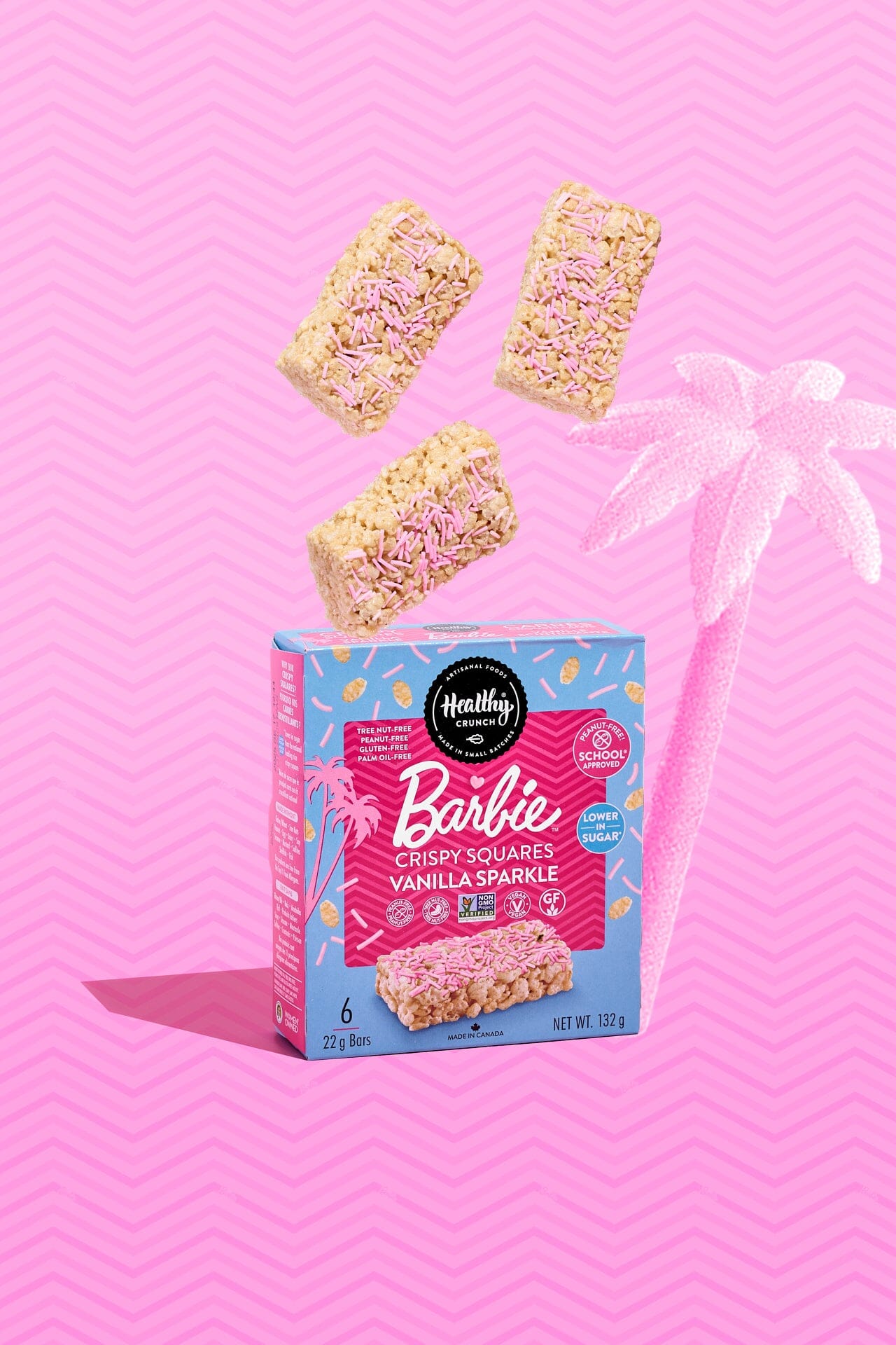 Box of Barbie-themed Rice Krispy Squares on a pink background