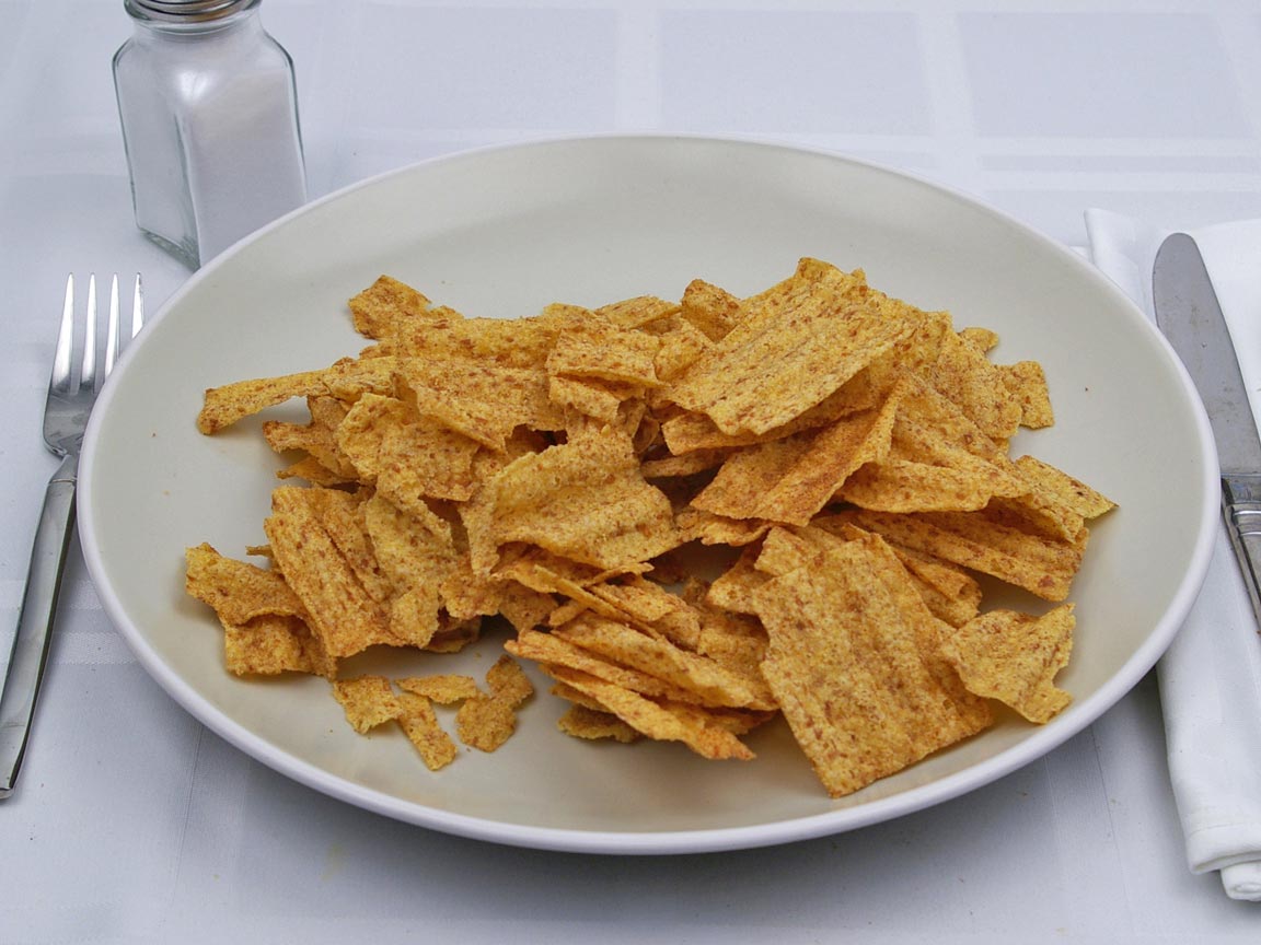 SunChips Harvest Cheddar Flavored Multigrain Snacks, 106g, harvest cheddar snacks on a plate.