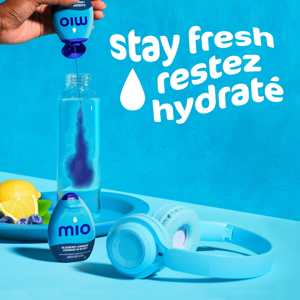 Mio water bottle with lemon and blueberry, sunglasses, and 'stay fresh' text on a blue background.