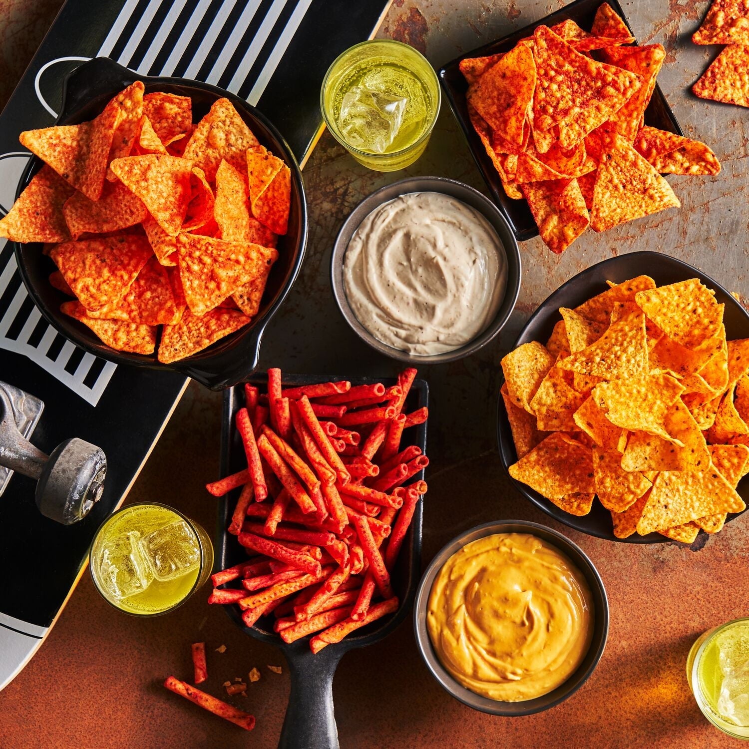 A variety of Doritos Tortilla Chips with a brown background