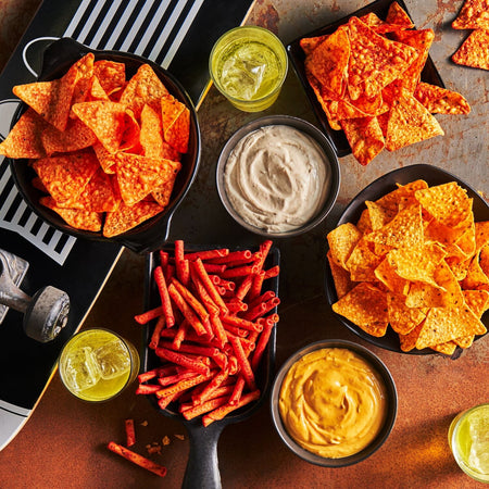 A variety of Doritos Tortilla Chips with a brown background