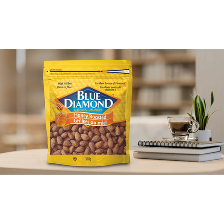 Bag of Blue Diamond honey roasted peanuts on a desk with a blurred background