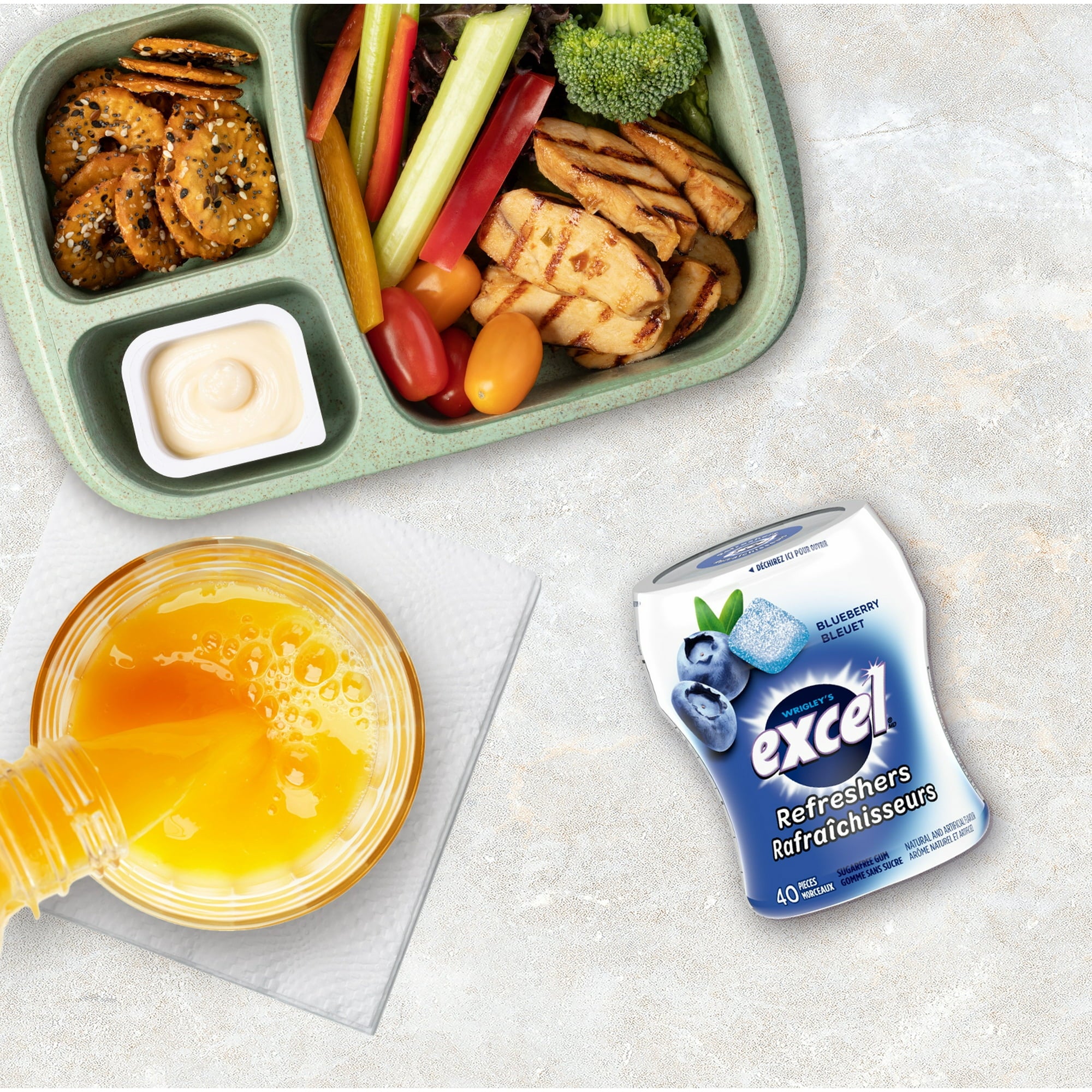 Excel Sugar-Free Gum, Refresher Blueberry, 6 ct. Package, one bottle on lunch table.