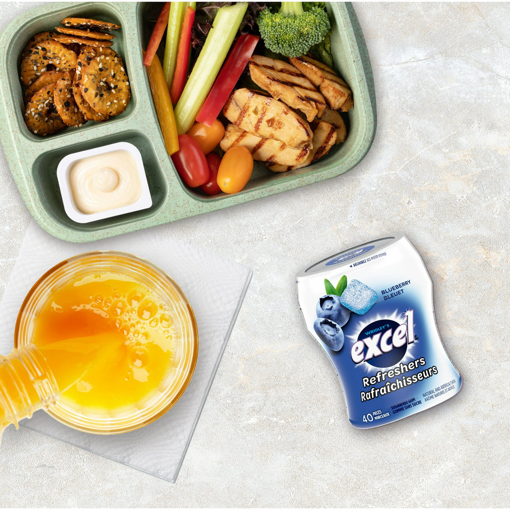 Excel Sugar-Free Gum, Refresher Blueberry, 6 ct. Package, one bottle on lunch table.