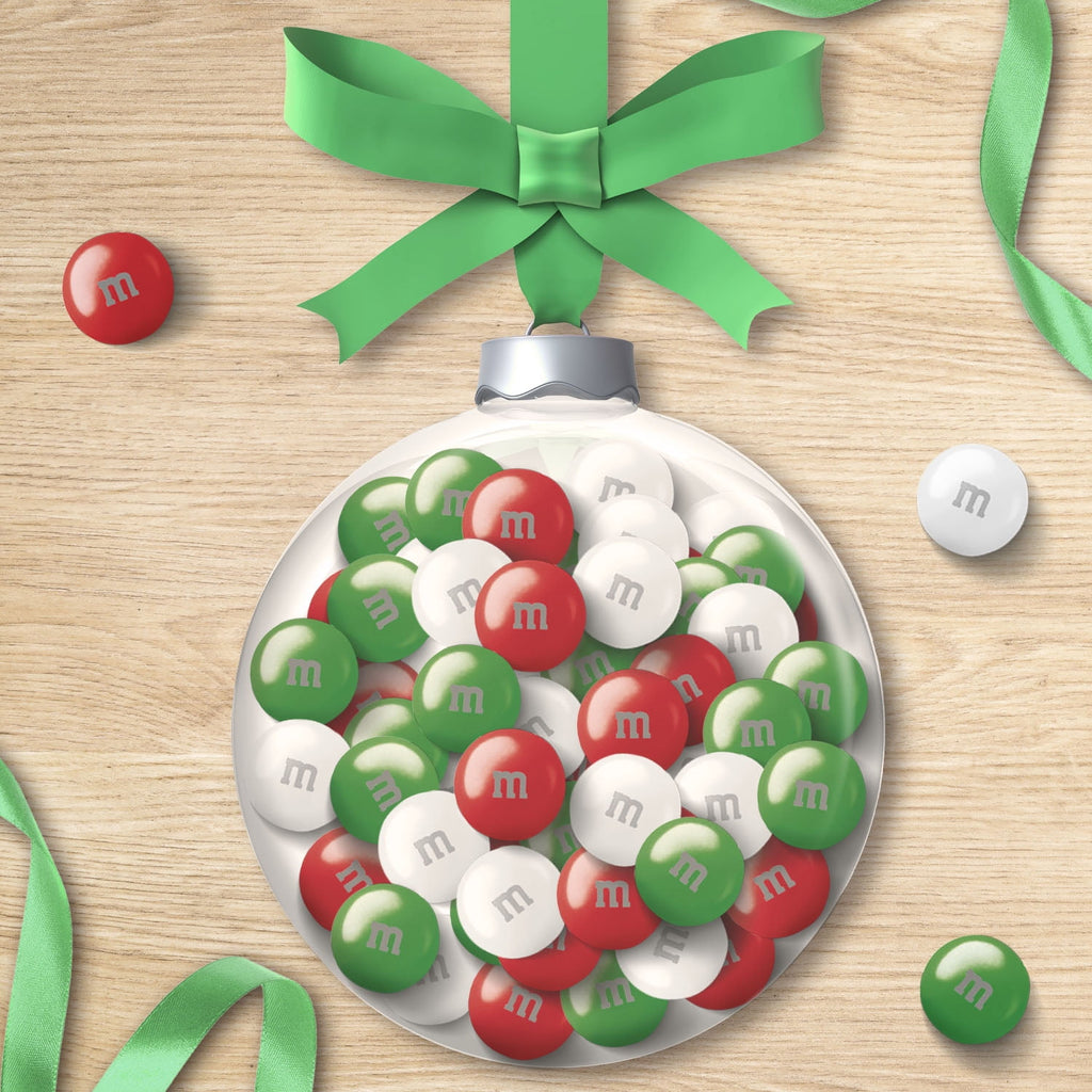 A Christmas ornament filled with M&M's Holiday Mint Milk Chocolate Candies