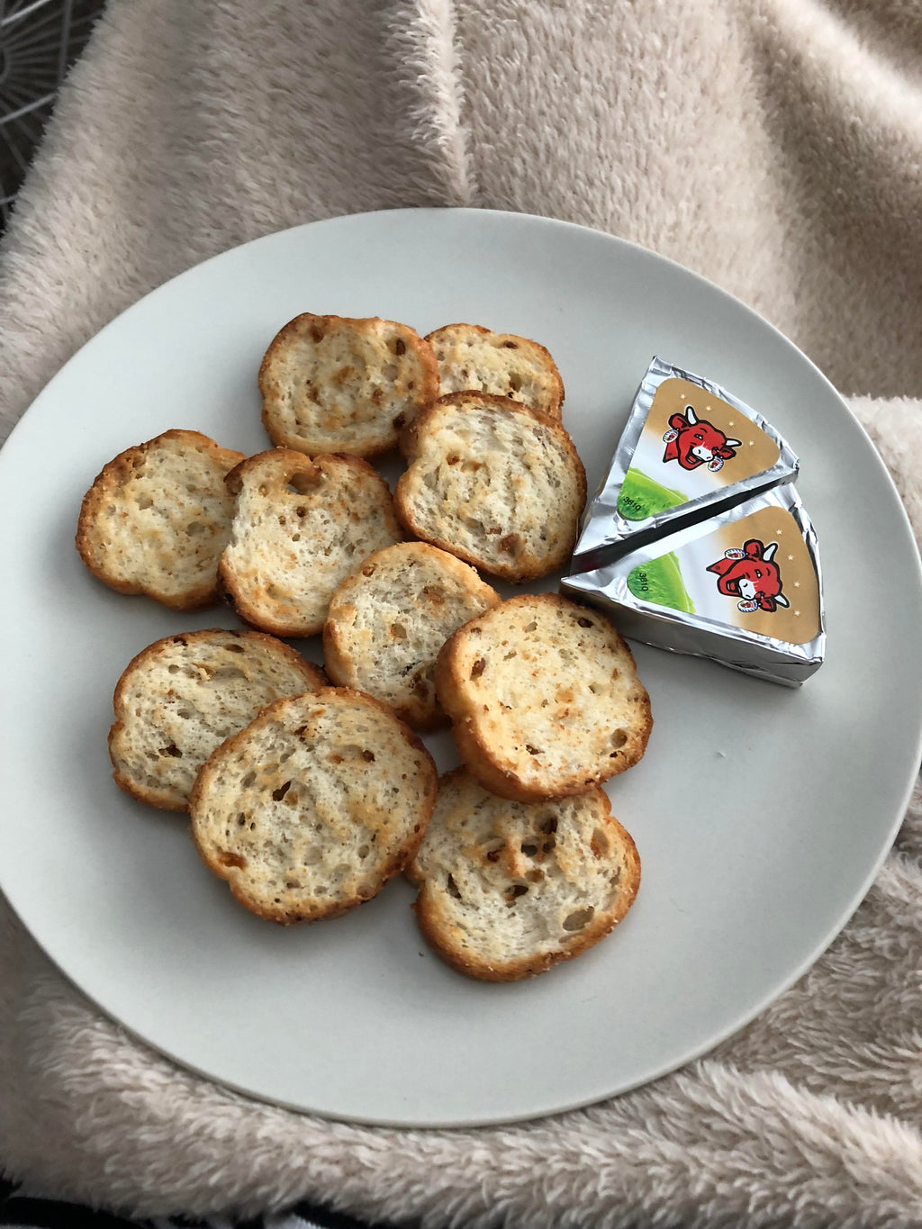 Boulangerie Grissol Baguettes, Roasted Garlic, 120g, baguette slices on a plate.