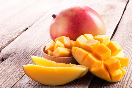 https://www.natural-cure.org/wp-content/uploads/diet-and-nutrition-Mango-The-King-of-Fruit-has-Incredible-Health-Benefits-1024x674.jpg, picture of mangos on a table.